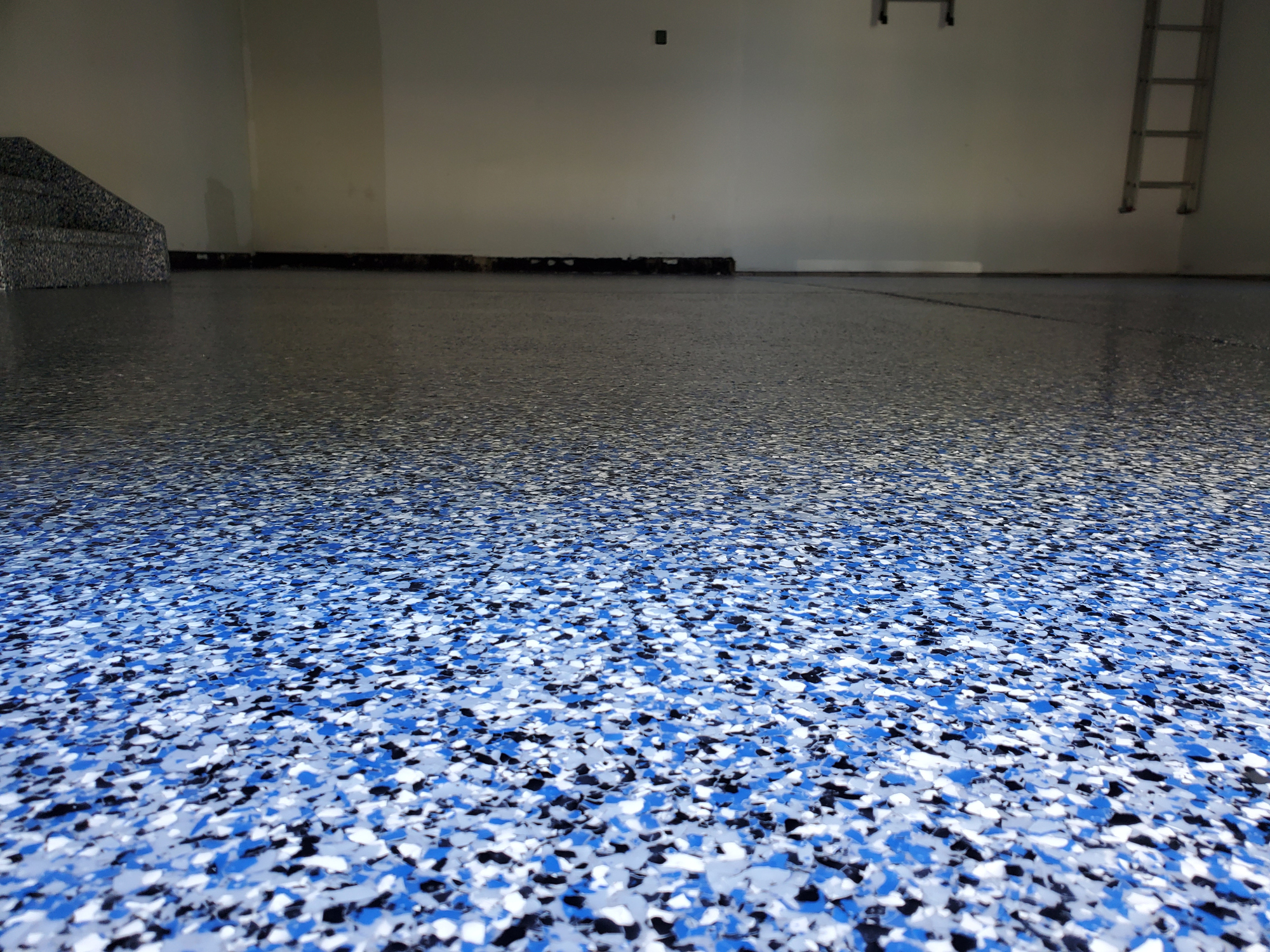 Vivid blue flake polyaspartic garage floor coating in Boise, Idaho