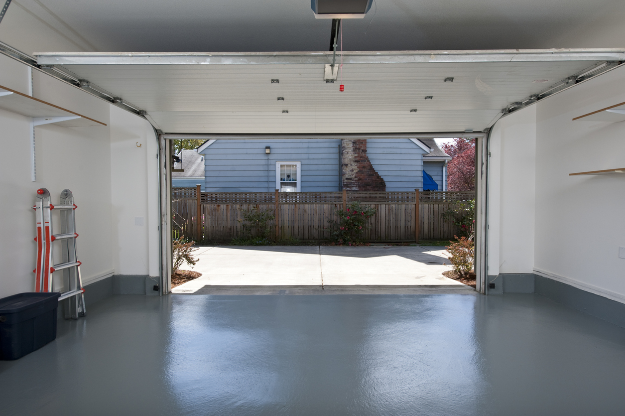 Clean residential garage with solid gray epoxy floor coating in Boise, Idaho